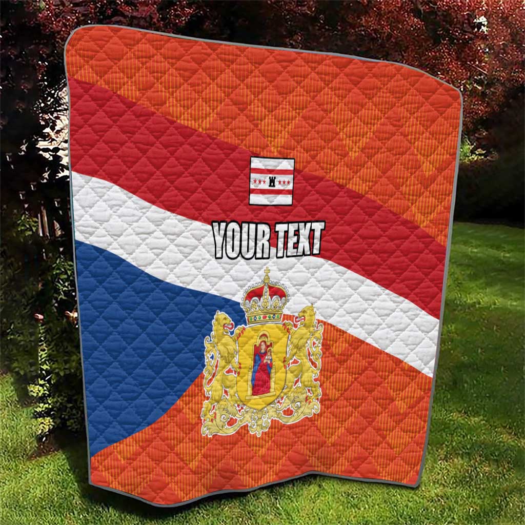 Personalized quilt flag with orange and blue diamond quilting, crest, and “YOUR TEXT”