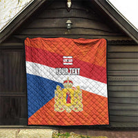 Orange quilt flag framed outdoors with blue and white stripes, crest emblem, “YOUR TEXT”