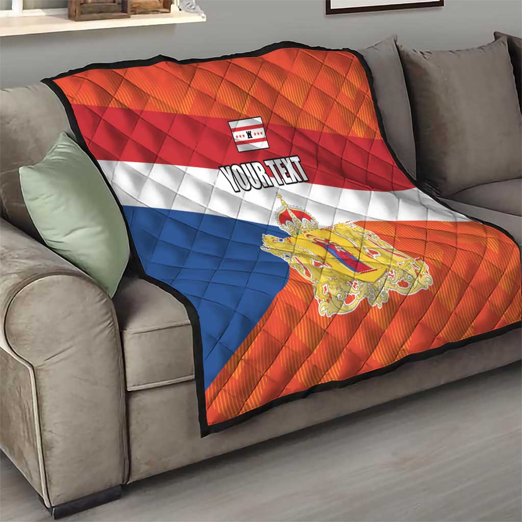 Orange quilt flag on a couch with blue and white stripes, crest emblem, and “YOUR TEXT”