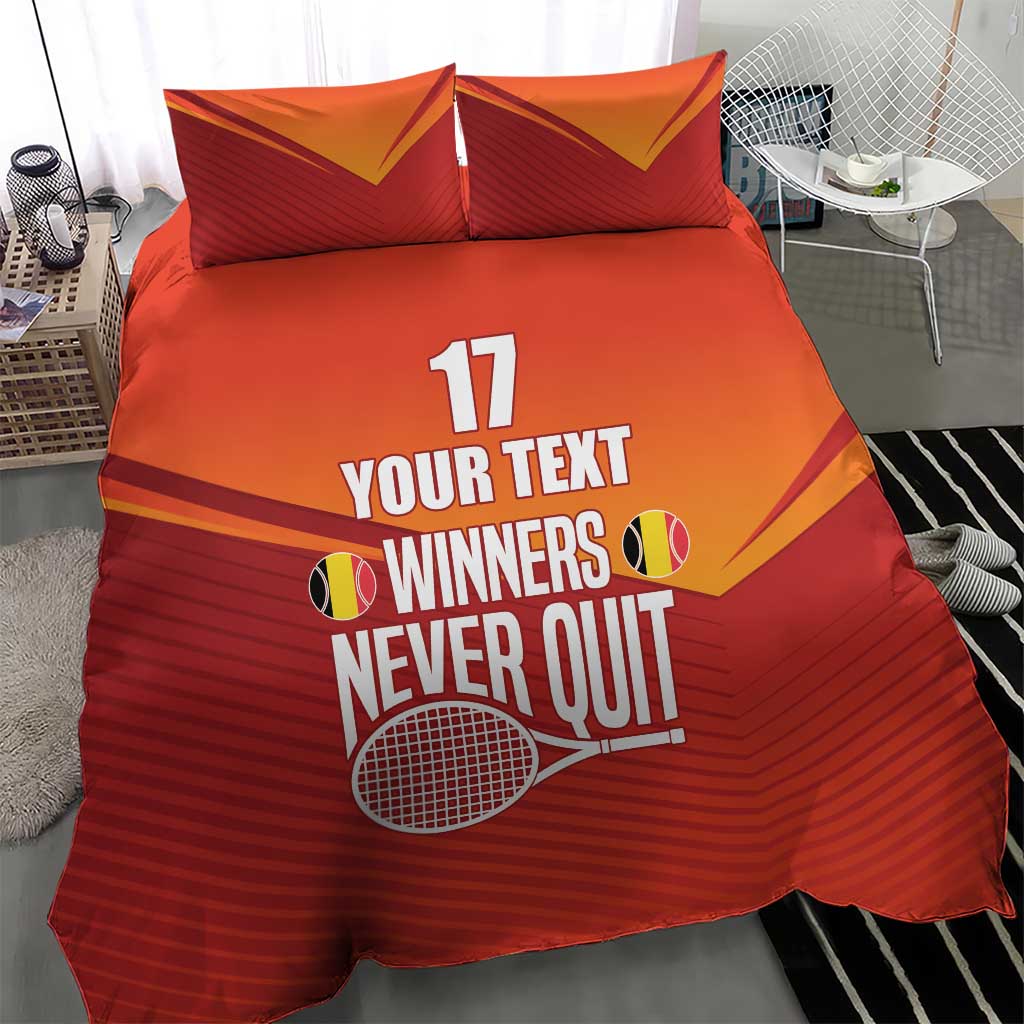 Red and orange duvet with two pillows featuring tennis graphic and “WINNERS NEVER QUIT”