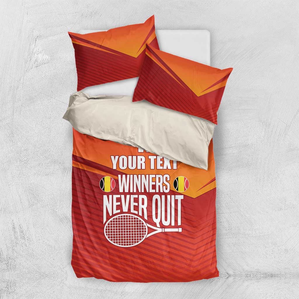 Red and orange duvet and pillow set with yellow accents and printed tennis slogan
