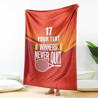 Red tennis blanket displayed with 'WINNERS NEVER QUIT' text and number 17