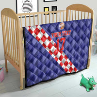 Blue quilt over crib with red-and-white check diagonal stripe, basketball icon, and “YOUR TEXT 17”