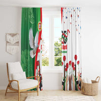 Green and white window curtains with red carnations, dove, and flag graphic, hanging from above