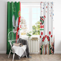 Front view of green and white window curtains with red carnations and dove motif over floor