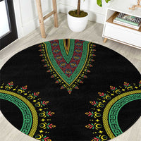 Black round carpet with green and yellow dashiki medallion and circular border