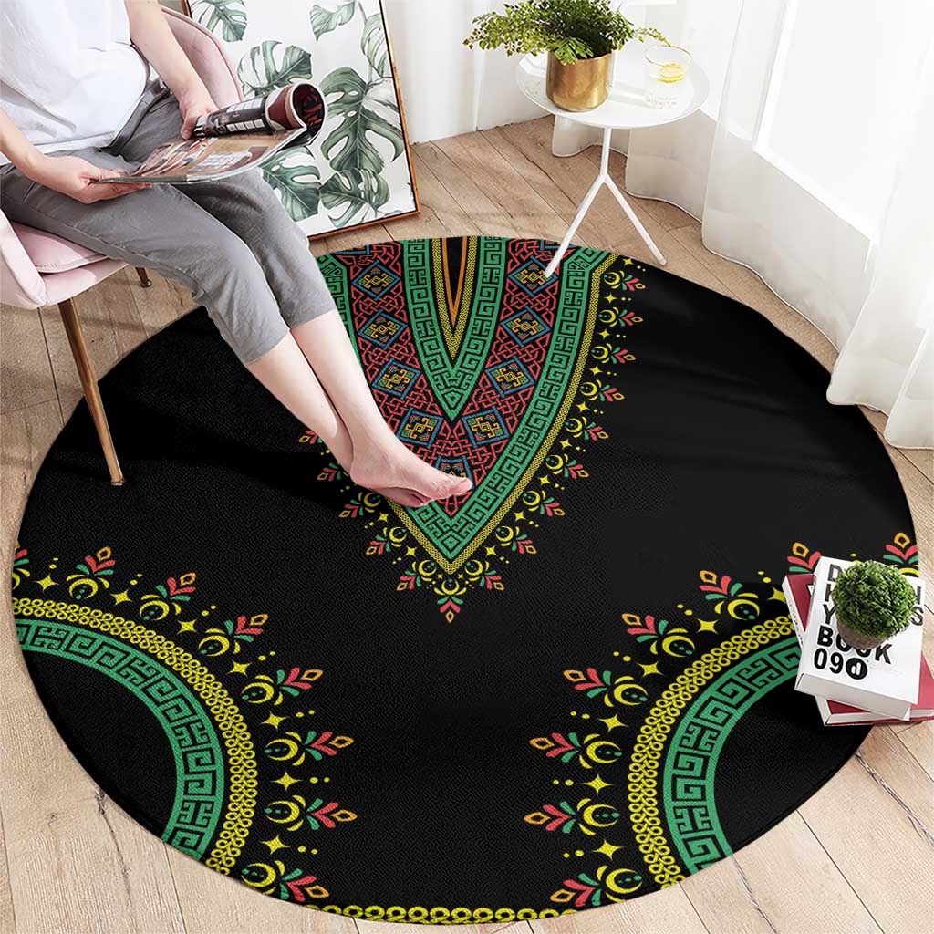 Black circular carpet with green-and-yellow V-shaped dashiki pattern and ornate border