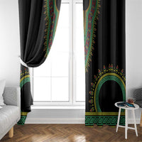 Black window curtain with colorful green, yellow, and red arch emblem and trim