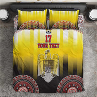 Yellow and black striped bedding set with eagle crest and circular decorative border