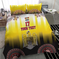 Yellow and black striped duvet and pillow set with eagle crest, 'YOUR TEXT', and patterned hem