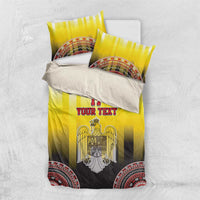 Yellow and black bedding set with eagle crest on duvet and matching pillow covers