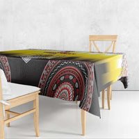 Yellow and black tablecloth with red circular medallion design and draped corners