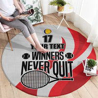 Round tennis carpet, grey with red swirl, “Winners Never Quit” and tennis ball icons