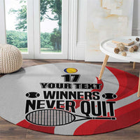 Round tennis carpet, grey with red swirl and “Winners Never Quit” banner with 17
