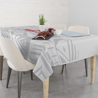 White custom football tablecloth with gray geometric pattern, over rectangular dining table