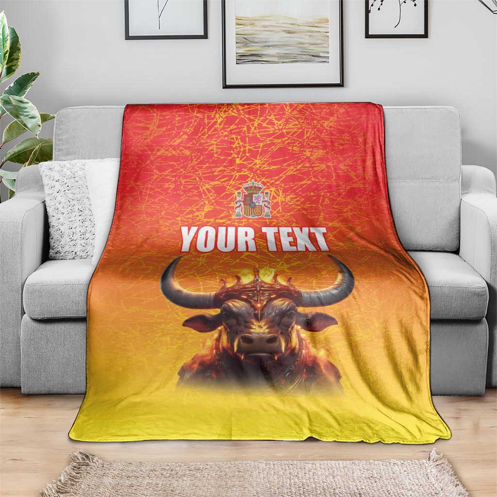 Personalized Spain blanket with crowned bull, coat of arms, and 'YOUR TEXT' on sofa