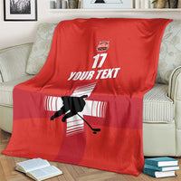 Red ice hockey blanket showing hockey player silhouette, YOUR TEXT, and 17 on the fold