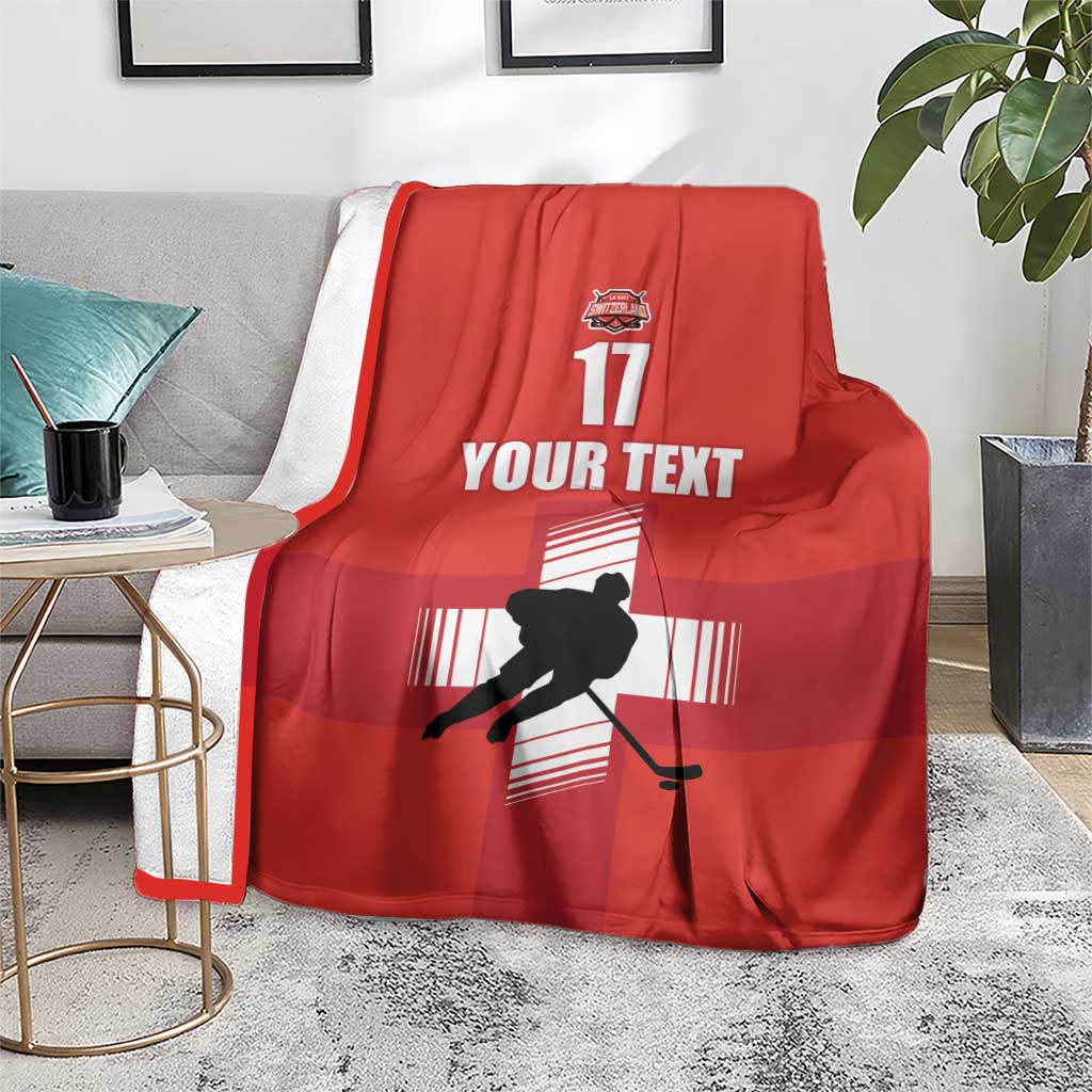 Red ice hockey blanket with hockey player silhouette, YOUR TEXT, and 17 print, draped