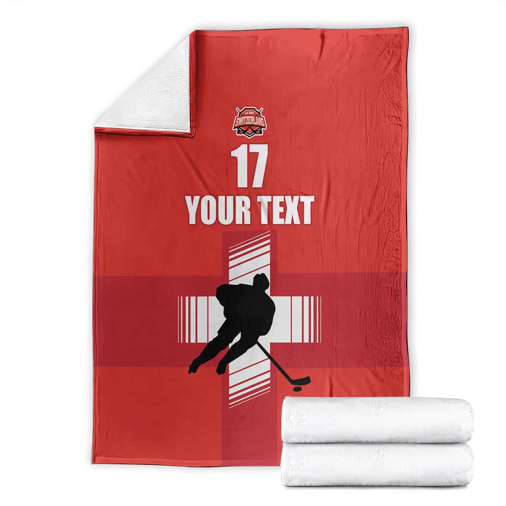 Folded red ice hockey blanket with hockey player silhouette, YOUR TEXT, and 17 graphic