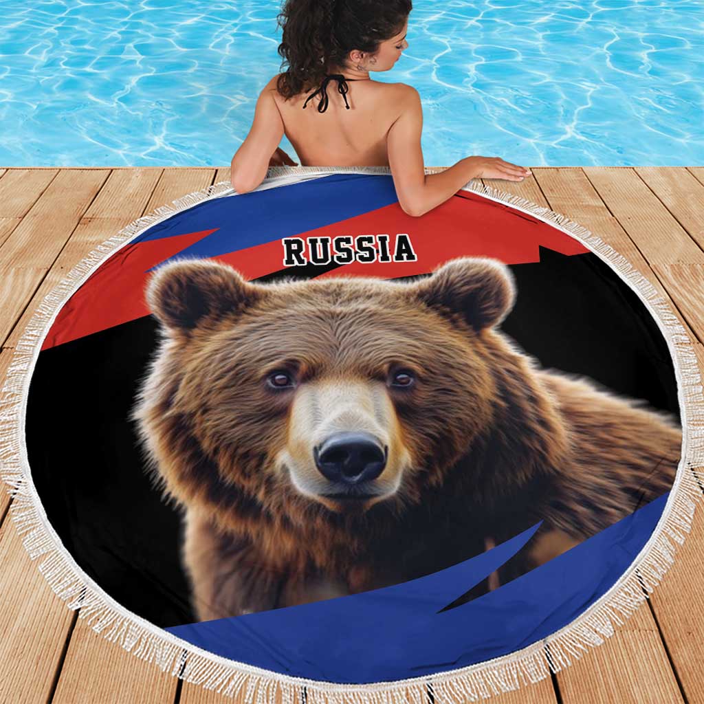 Round Russia bear beach blanket with white fringe on wooden pool deck