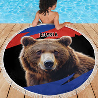 Round Russia bear beach blanket with white fringe on wooden pool deck