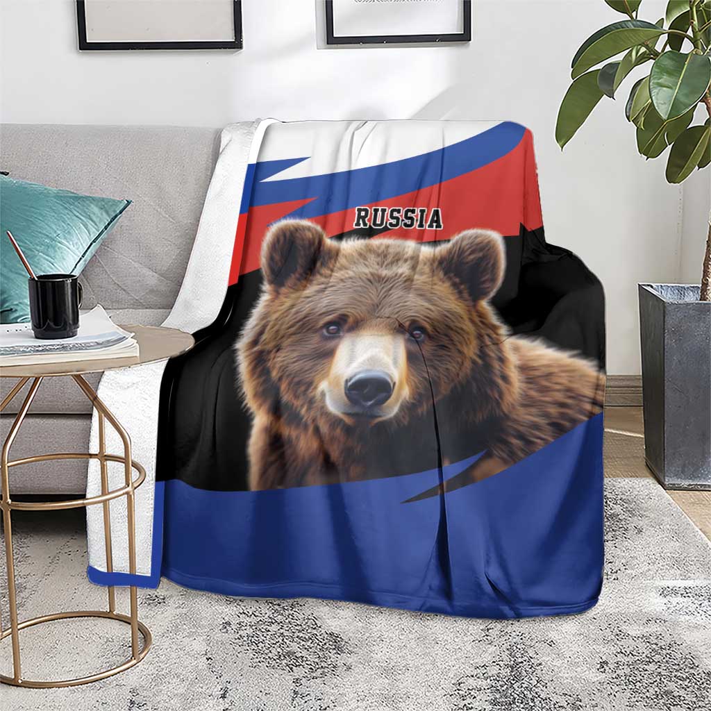 Brown bear blanket with Russia flag print, on sofa, bear face close-up