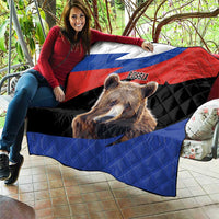 Quilt blanket with Russian flag and brown bear face, draped over a couch