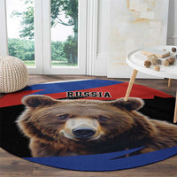 Round rug close-up showing brown bear eyes and RUSSIA text in red black and blue