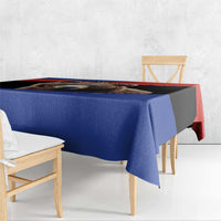 Blue tablecloth with bear-image strip and red corner accent along the hanging edge