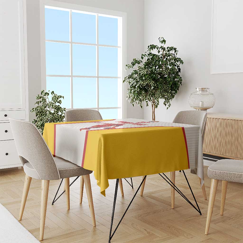 White and yellow basketball tablecloth with red border, draped over dining table