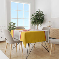 White and yellow basketball tablecloth with red border, draped over dining table