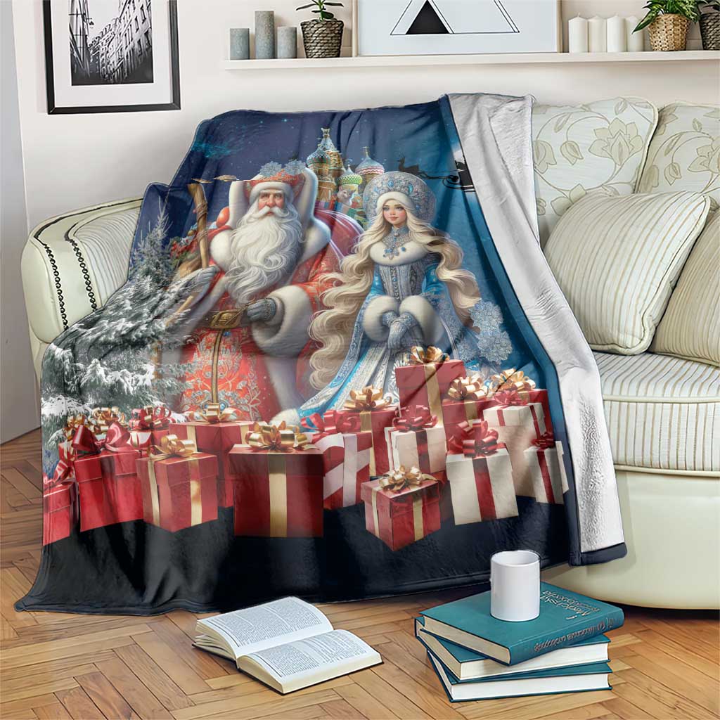 Blue Christmas blanket featuring Ded Moroz and Snegurochka beside gift boxes and snow trees