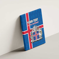 Blue Iceland flag canvas wall art with coat of arms and 'YOUR TEXT', wall-mounted