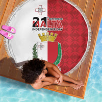 Round Malta Independence Day beach blanket with red patterned side, coat of arms, fringed