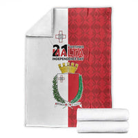 Folded Malta Independence Day flag blanket, red patterned side with coat of arms and cross