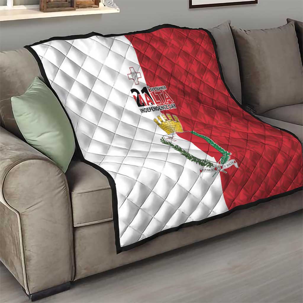 Malta Independence Day quilt blanket on sofa, white-and-red diamond pattern with emblem