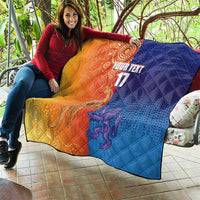 Orange and blue diamond-quilt blanket draped over sofa with centered 'YOUR TEXT' and '17'