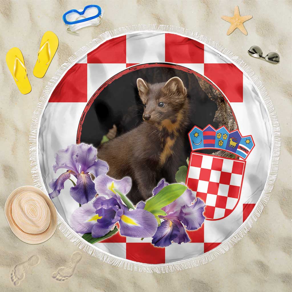 White round beach blanket with fringed edge, pine marten, purple irises, red-white shield.