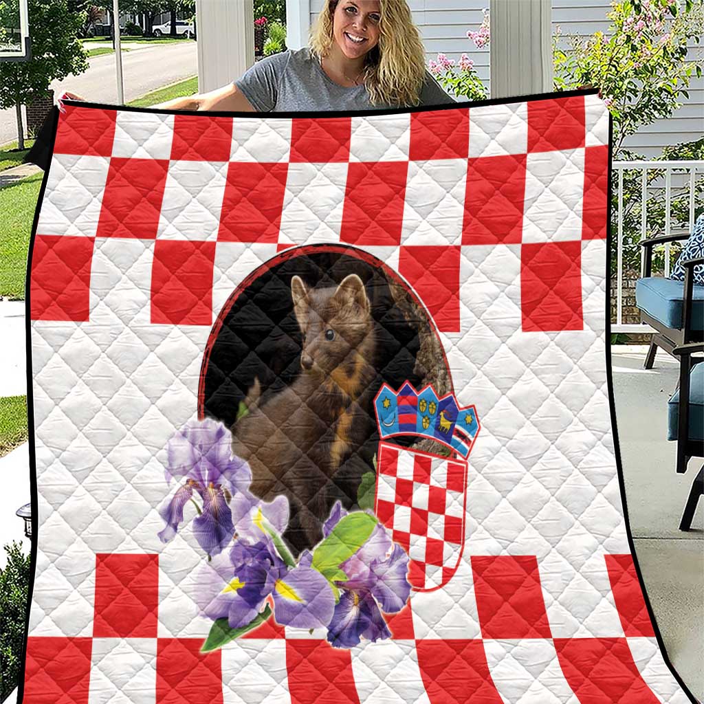 Quilt blanket with red-and-white checker pattern, pine marten with crown, iris flowers.