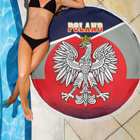 Round beach blanket with Poland text and crowned eagle emblem on red, navy top, white fringe
