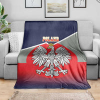 Poland-themed blanket draped on a sofa, crowned eagle over red circle with dark blue border