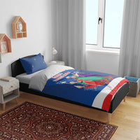 Blue duvet cover and pillowcases featuring Three Kings artwork with red/white trim