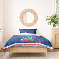 Blue duvet cover with Three Kings illustration and red/white stripe, two matching pillows