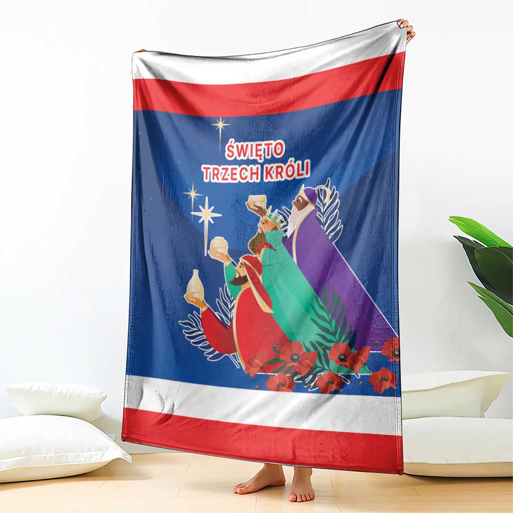 Blue Three Kings Day blanket hanging with red-and-white stripes and illustrated kings