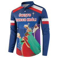 Blue button sweatshirt with red-white stripes and Three Kings text over nativity