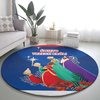 Blue round rug with nativity procession of three kings, star accents, and red flowers