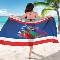 Blue Three Kings Day sarong draped across back with red and white stripe trim