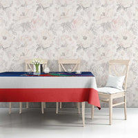 Blue and red Three Kings Day tablecloth on rectangular dining table