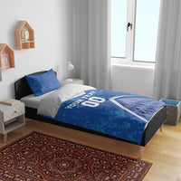 Blue bedding set with Colosseum image, white accents, and YOUR TEXT 00 on duvet