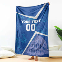 Blue football-style blanket with white diagonal stripes, “YOUR TEXT 00,” and Colosseum graphic